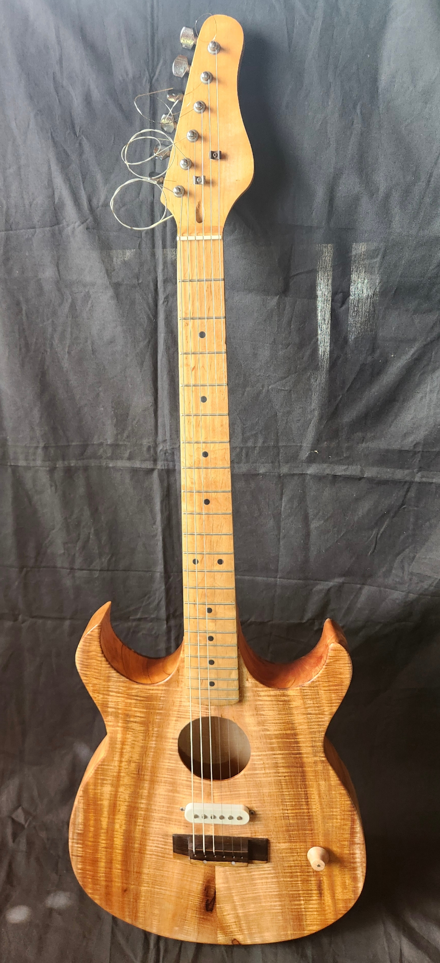 Handcrafted koa electric guitar