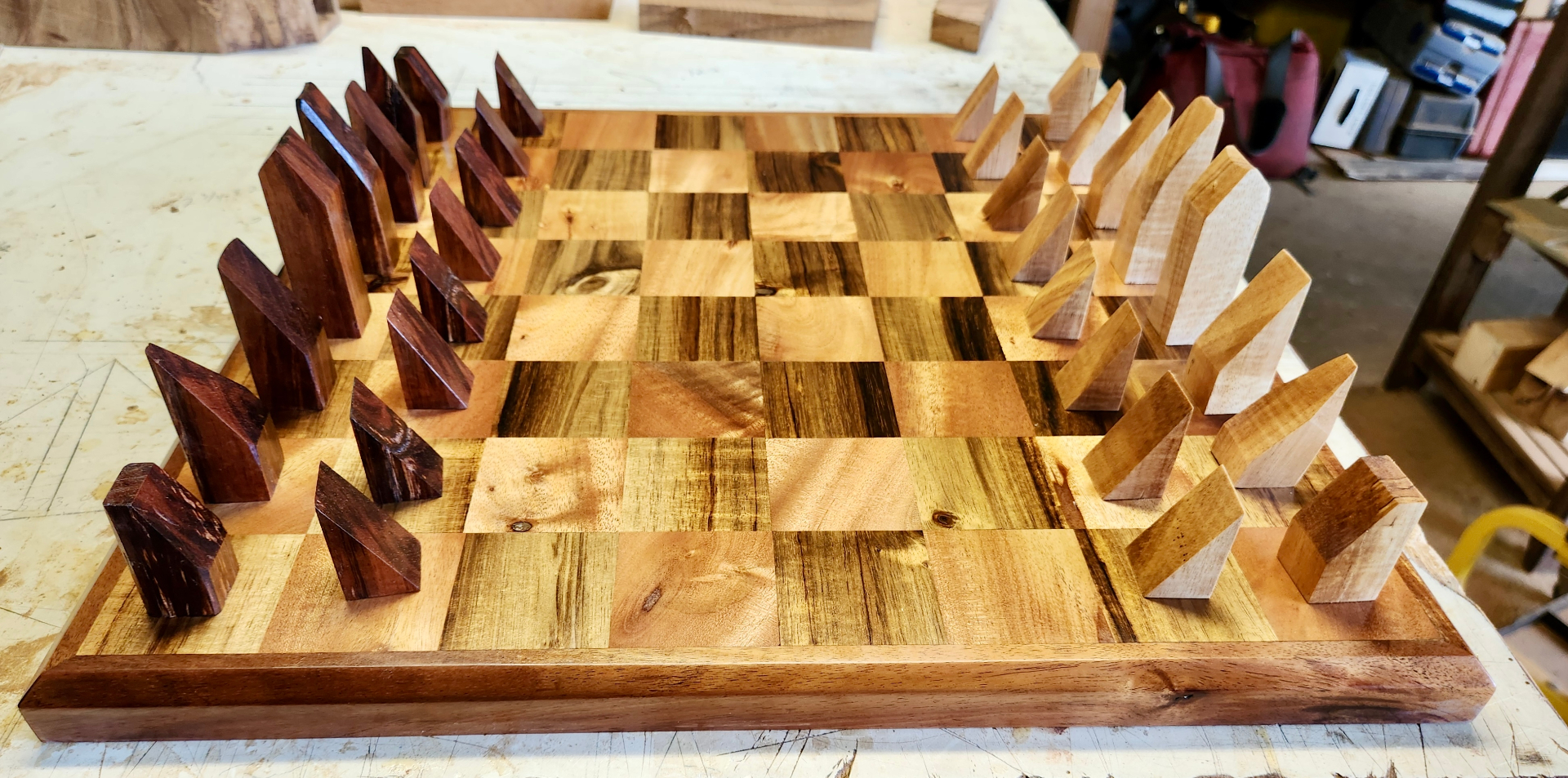 Handcrafted wooden chessboard with angular pieces