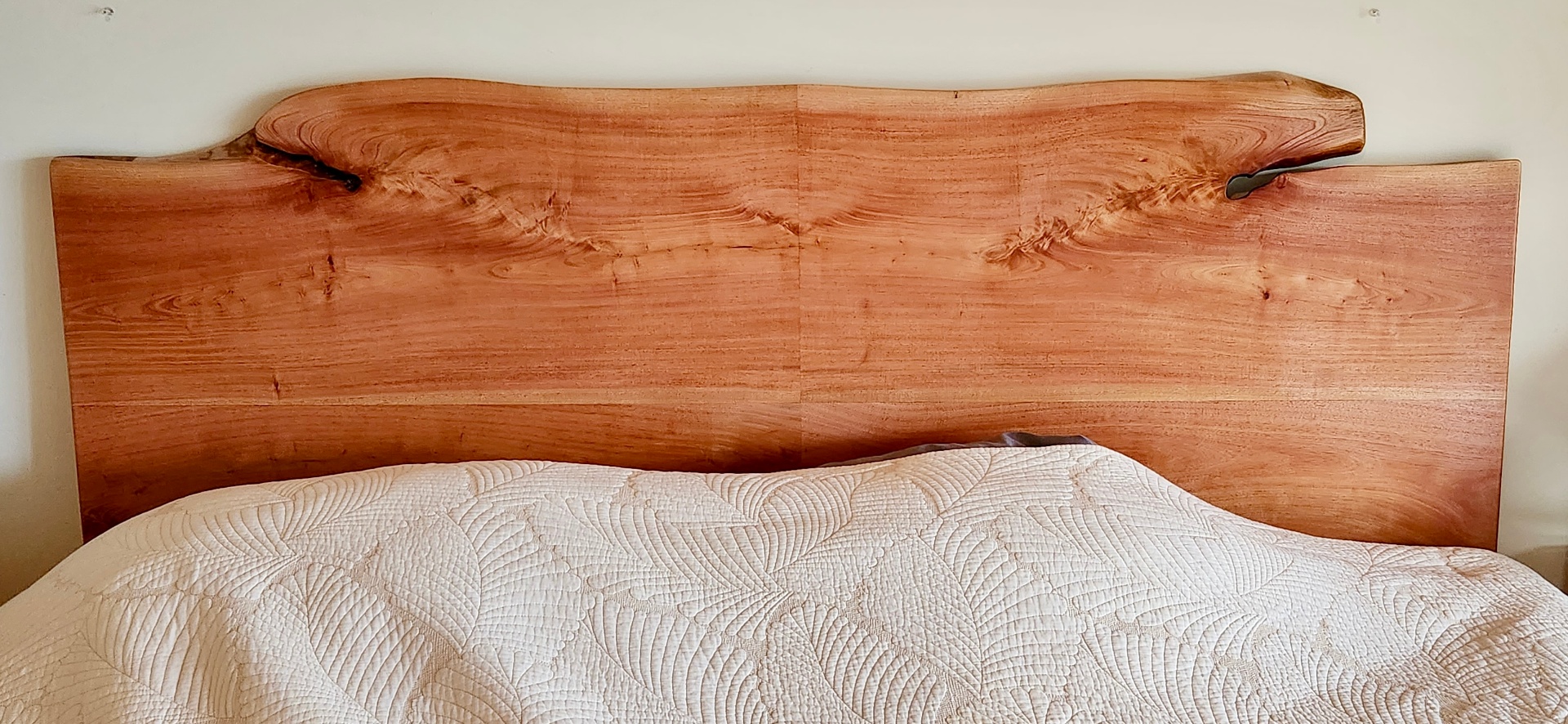 Live-edge hardwood headboard