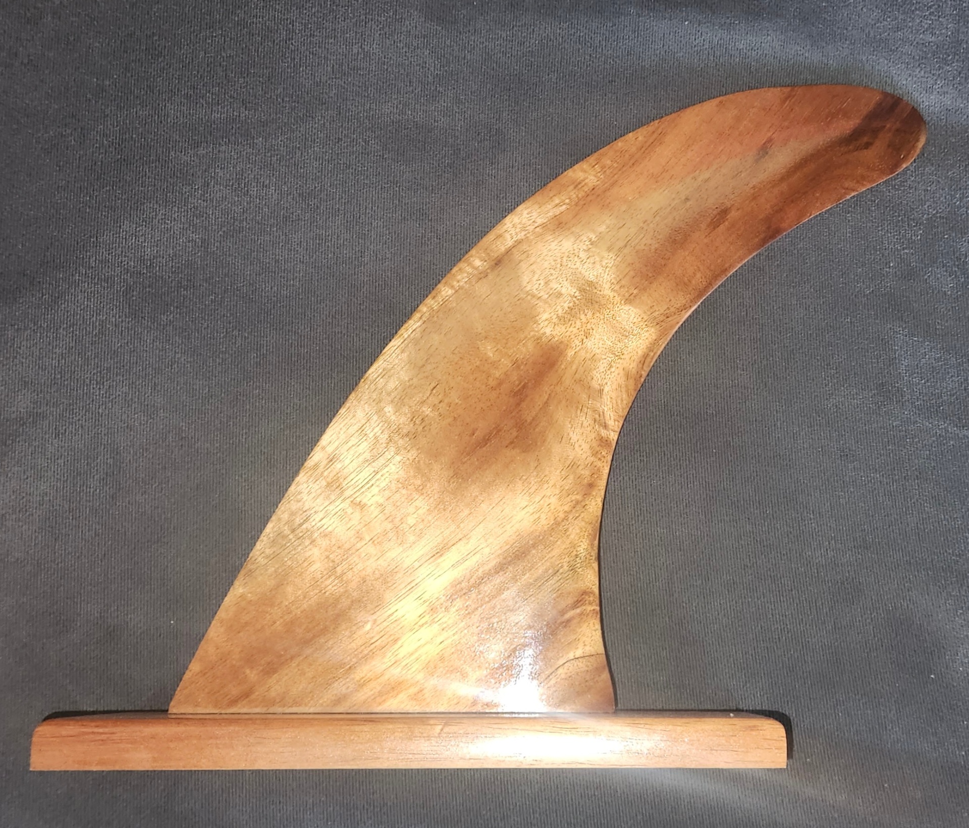 Hand-shaped wooden longboard surf fin