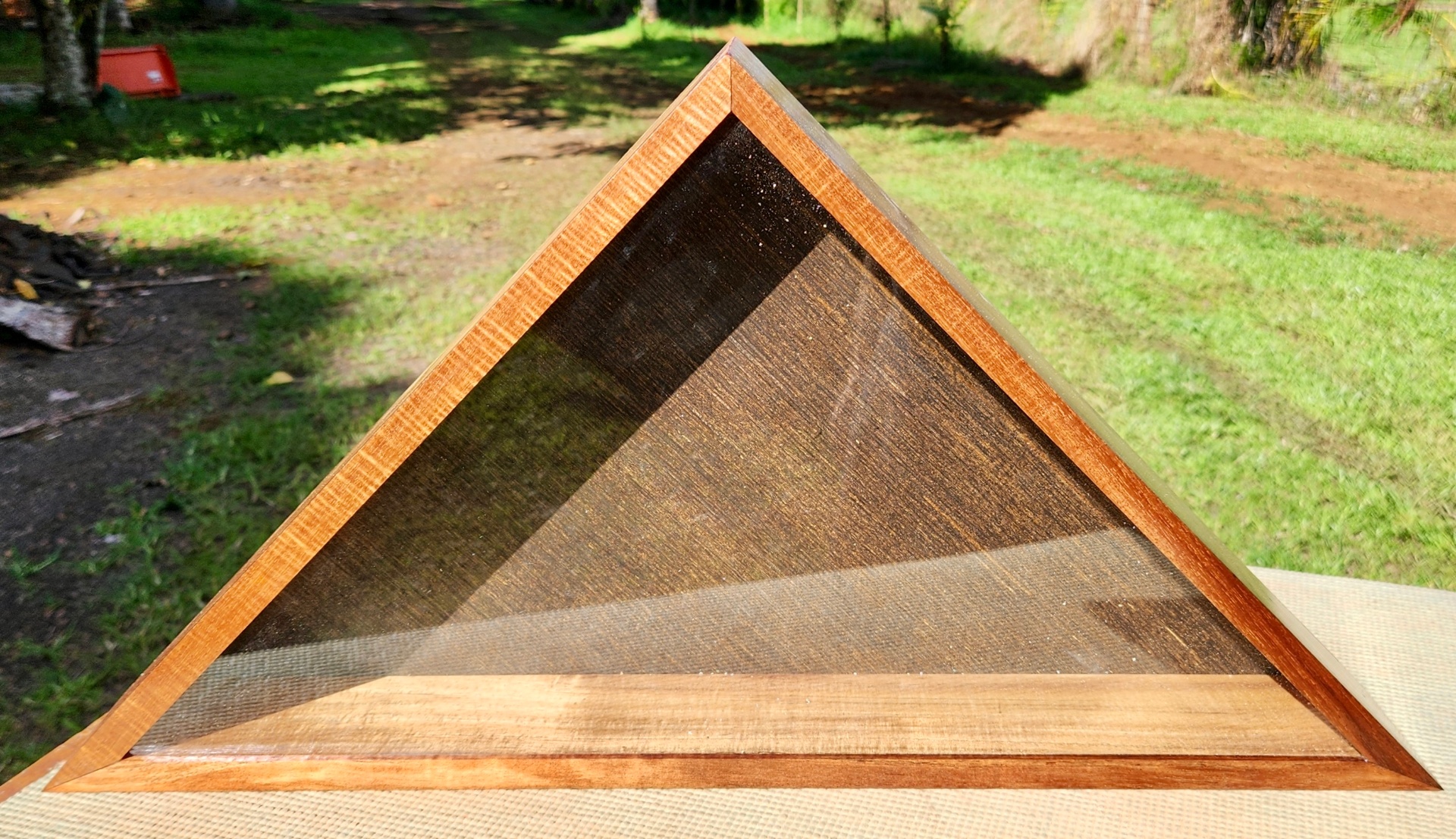 Triangular wooden flag display case